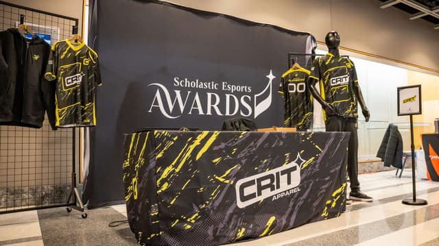 Custom team jerseys on display at a branded awards booth
